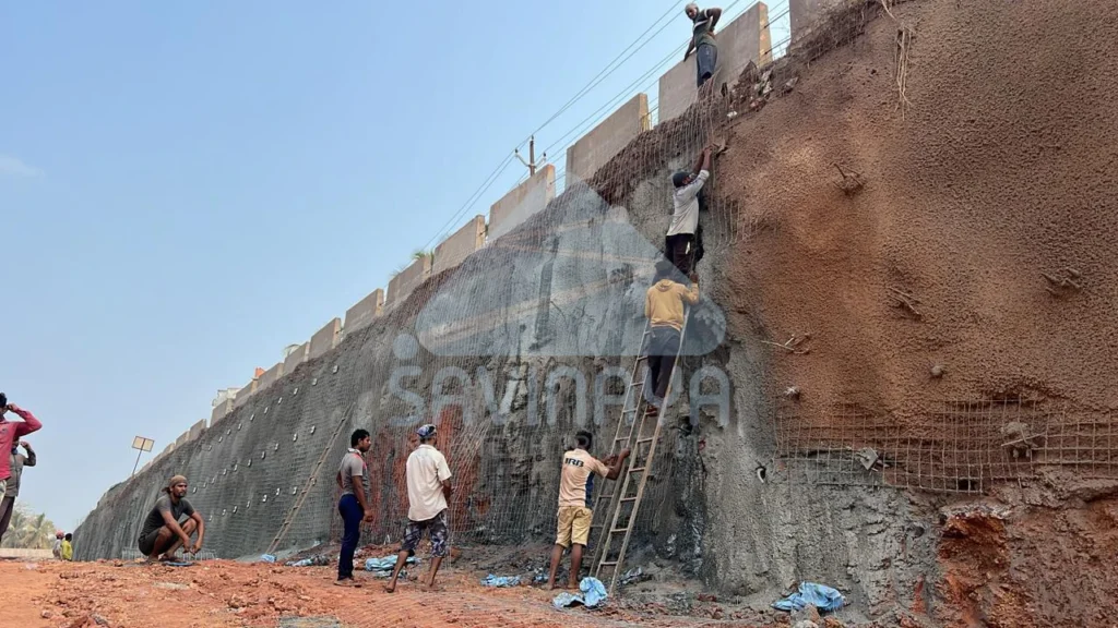 How Long Does Soil Nailing Last in Slope Stabilization Projects? 3 Workers installing mesh for soil nailing on highway walls