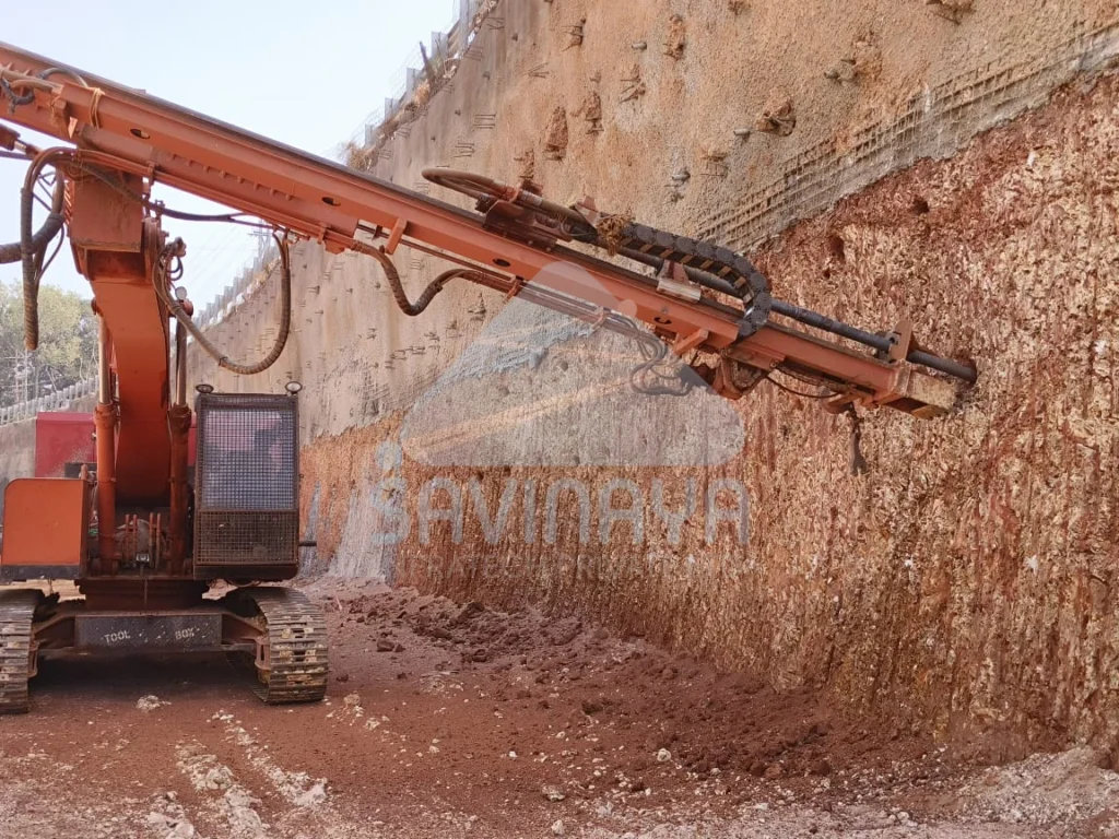 What is Soil Nailing and Its Advantages: How Savinaya Infra Ensures Stability and Strength 1 Soil nailing installation using hydraulic drill rig on-site