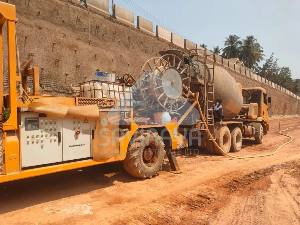 Shotcrete work with concrete pump on retaining wall 